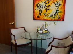 Conference table in large 2-window office