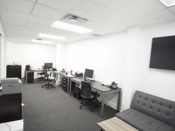 Perspective looking in to desk area from front door