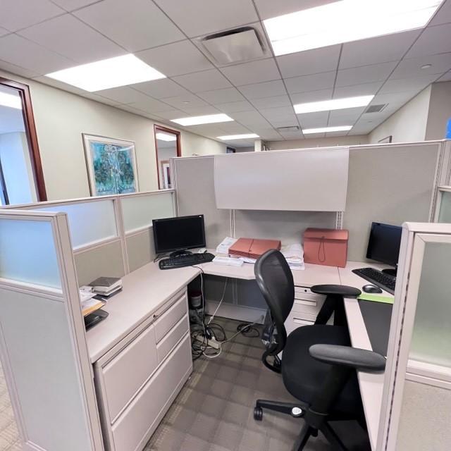 Workstation immediately outside corner office