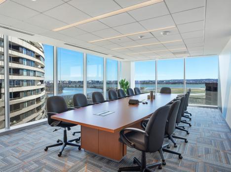 Large corner conference room with floor to ceiling windows