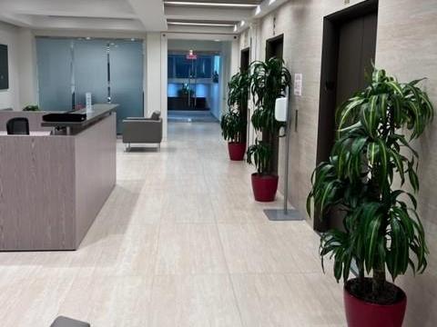 Modern elevator lobby with adjacent conference rooms