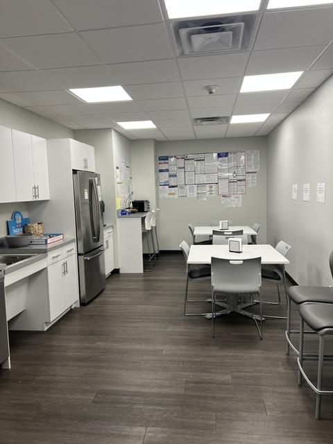 Kitchen and lunch room with 2 tables