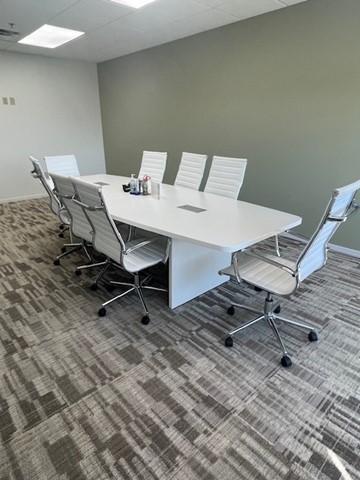 Large white table with 8 chairs