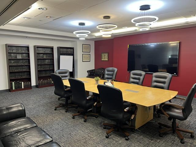 Meeting room with table, chairs and couch