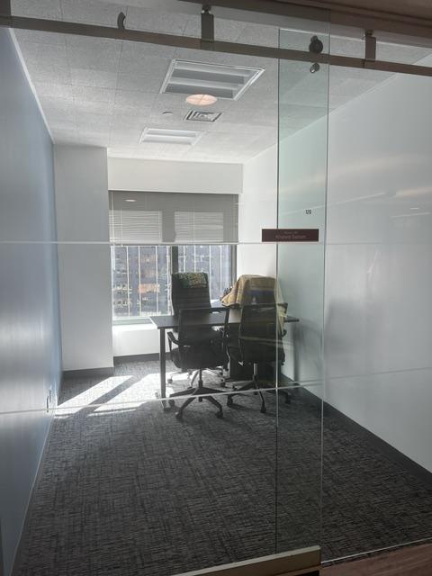 Office with desk and chairs