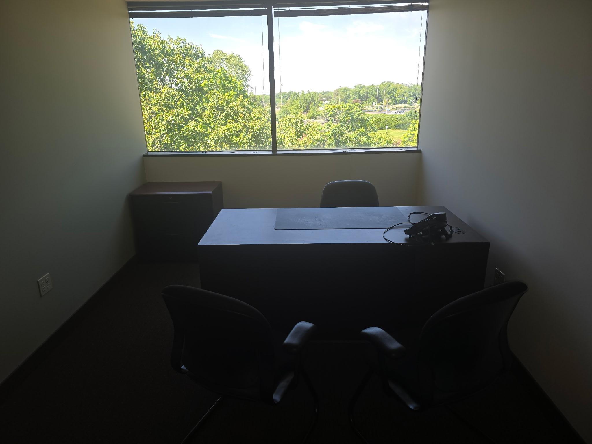 office with desk, chairs, files