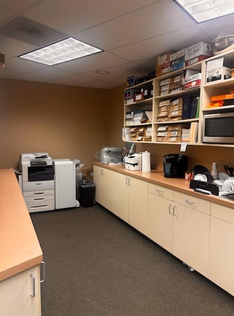 Room with supplies and cabinets